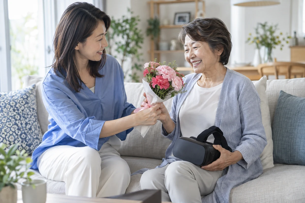 花束とVRゴーグルを囲み、感謝を伝える親子のイメージ